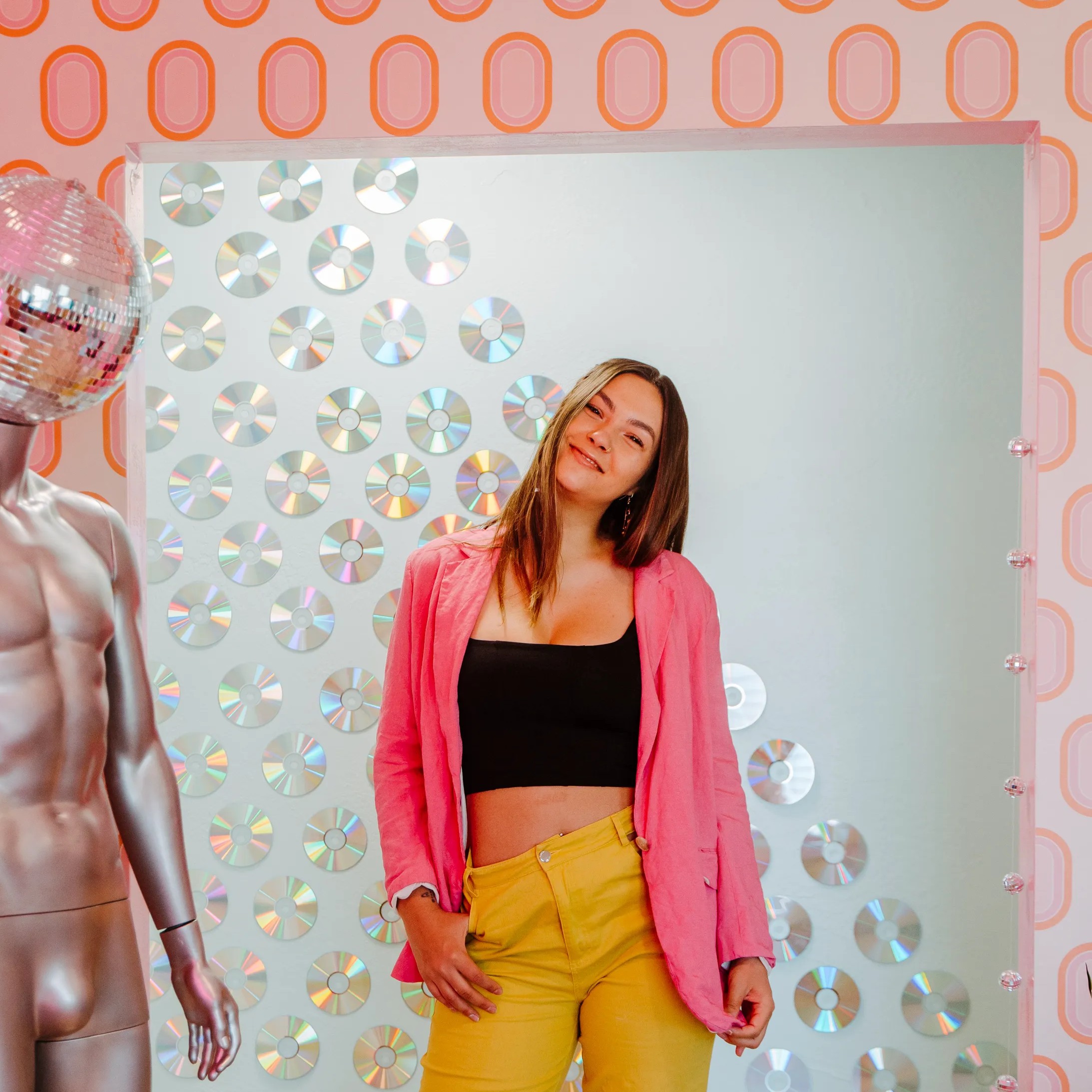 Bridgette in front of a mirrored disco wall